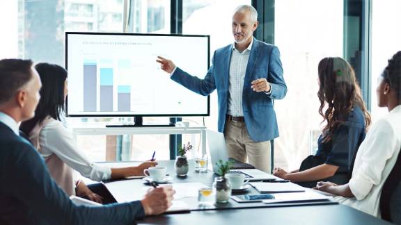 A person standing in front of a group of people.