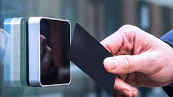 A hand holding a black card.