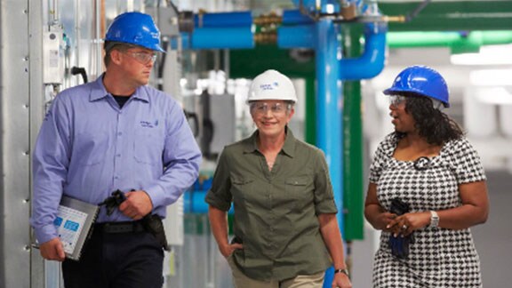Engineers walking with johnson controls hat