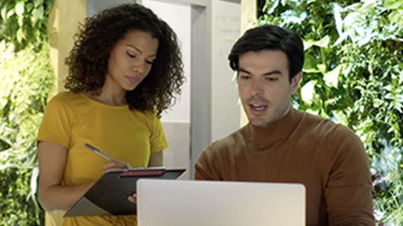 Young couple using laptop