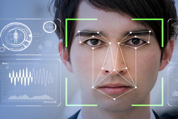 Portrait of a man with facial recognition graphics over his face