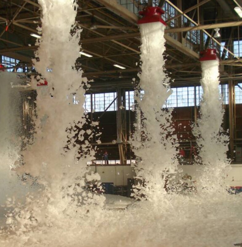 Foam-based fire suppression systems in operation in an industrial space