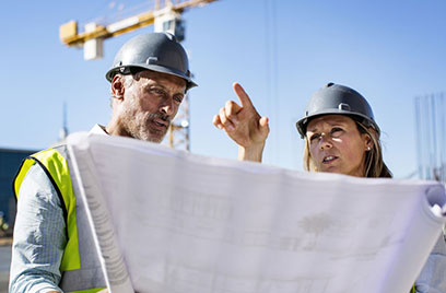 two people conversing at construction site