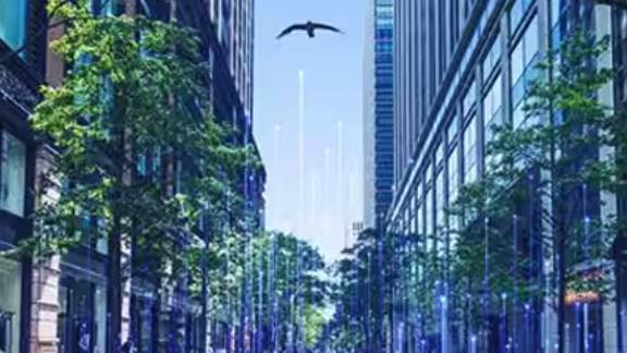 An eagle flying between two corporate buildings, surrounded by OpenBlue graphics