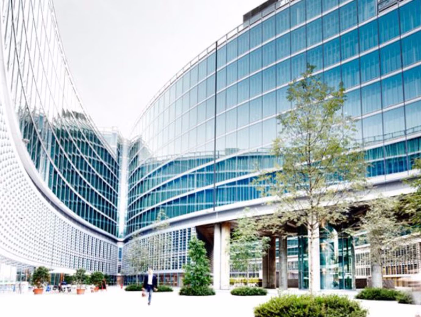 Man walking through an open space of a modern office premises