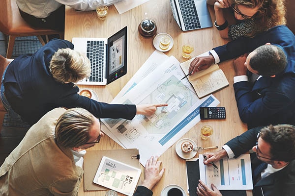 People having a discussion sitting at a conference table