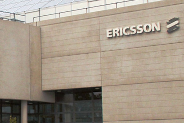 Outside an office building with the Ericsson logo