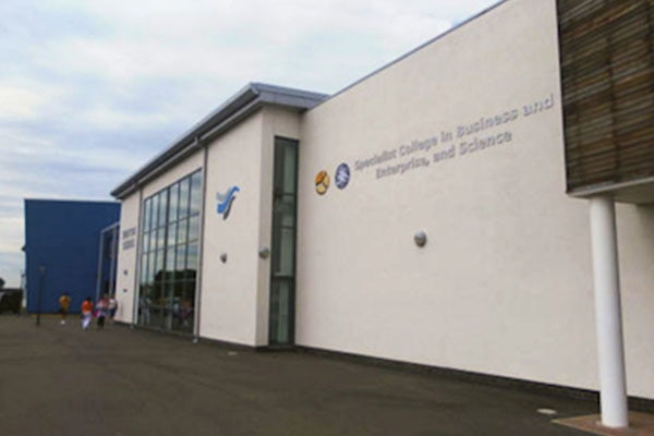 Exterior of a building with title 'Specialist College in Business and Enterprise, and Science'